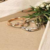 Minimalist couple rings with diamond accents, one rose gold pavé, one white gold single diamond, side by side